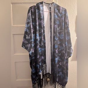 Hot Topic’s black velvet vest with purple & blue butterflies